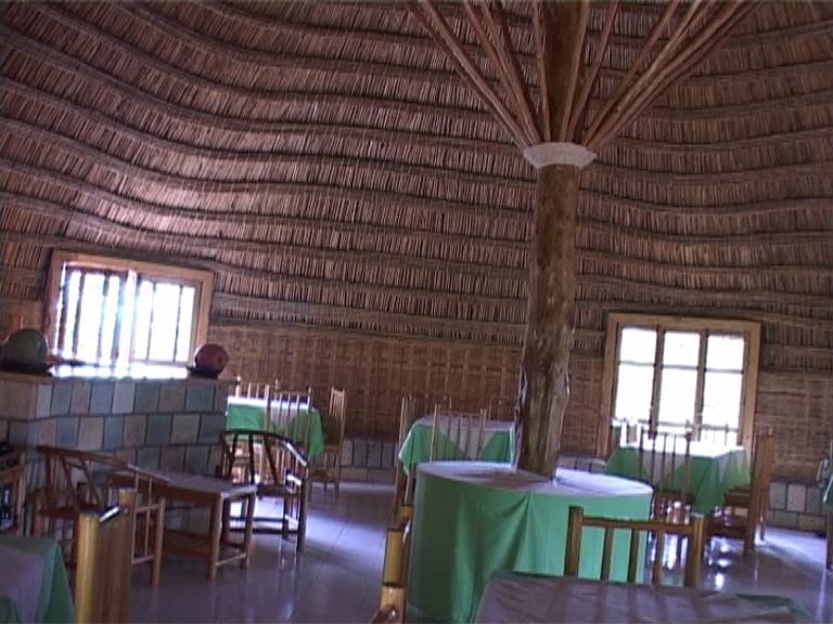 The bamboo-domed restaurant interior with green-clothed tables